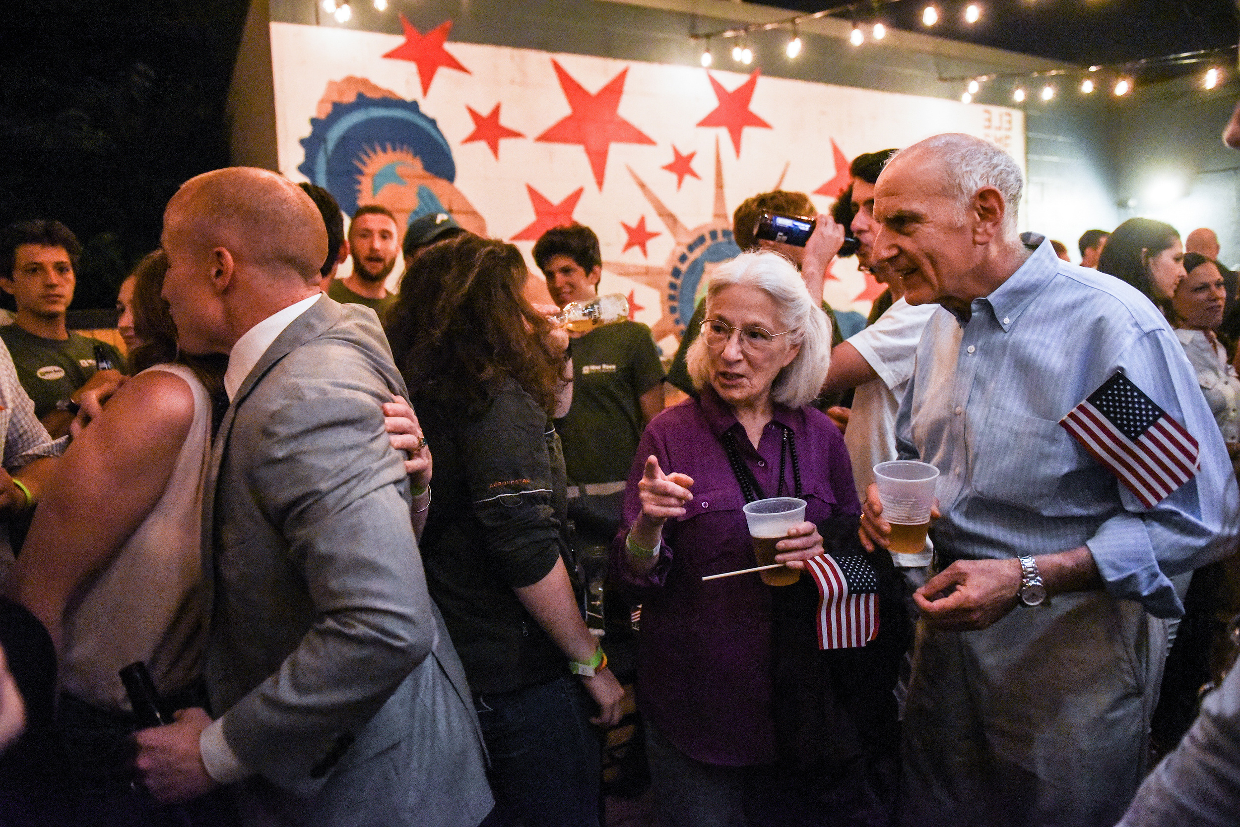 Max Rose (Left), candidate for Congress, greets supporters after winning the Democratic primary in Staten Island, NY, U.S. June 26, 2018. (Stephanie Keith for The New York Times)